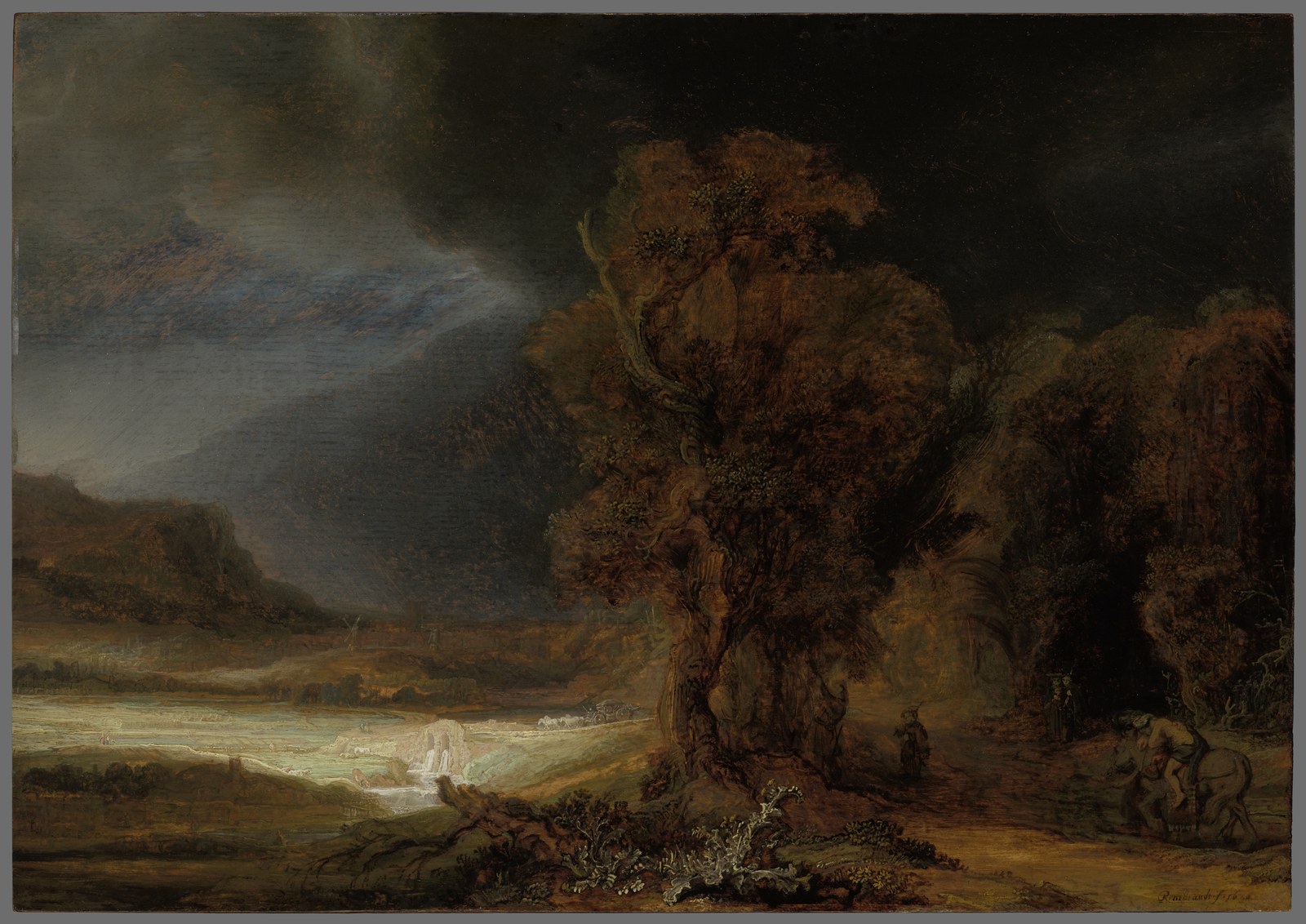 Rembrandt's landscape with the parable of the Good Samaritan: the Samaritan lifting the wounded traveler onto his horse